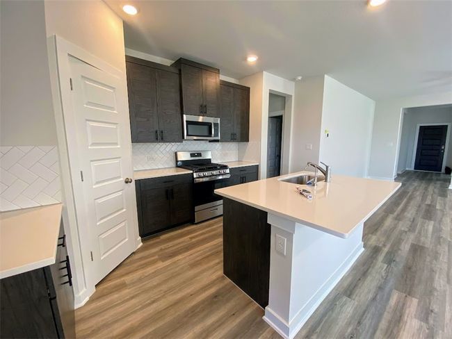 Quartz Countertops, large pantry, extended cabinets and more! | Image 5