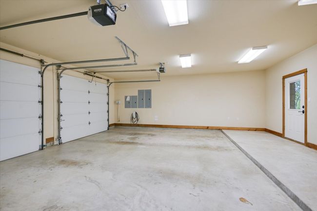 Inside the 3 car garage. There is an EV Charger. The UV Filter for the Secondary Water Supply and 2 Hot Water Heaters!!! | Image 31