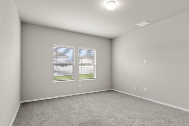 Unfurnished room featuring carpet, baseboards, and visible vents | Image 27