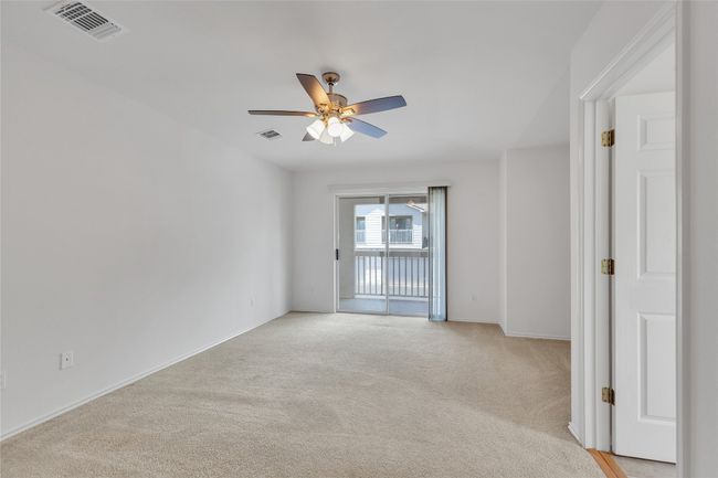 Spare room with light carpet and ceiling fan | Image 18