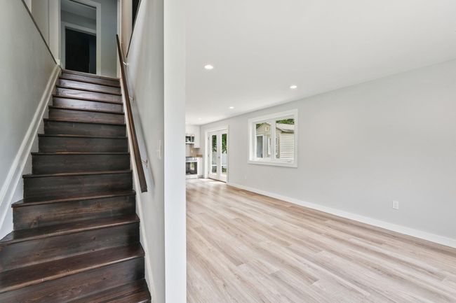 Stairway featuring wood finished floors and recessed lighting | Image 9