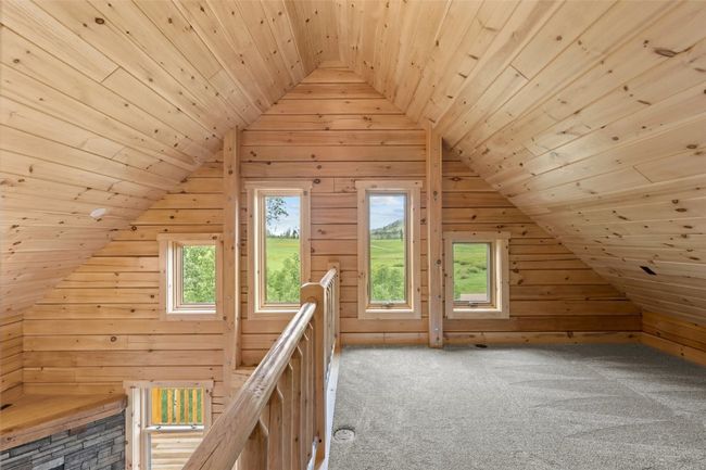 Additional upstairs living space with vaulted ceiling | Image 31