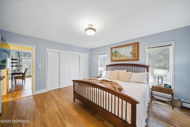 Primary Bedroom with Newer Bathroom with 2 sinks & great design, large windows & builtins in large closets. | Image 22