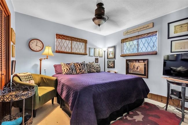 Bedroom featuring a ceiling fan | Image 41