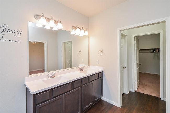 Your primary walk-in closet is right. | Image 17