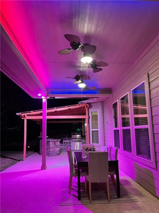 Dining room with a ceiling fan | Image 29
