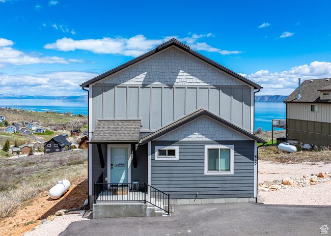 View of front facade featuring board and batten siding and a water view | Image 50