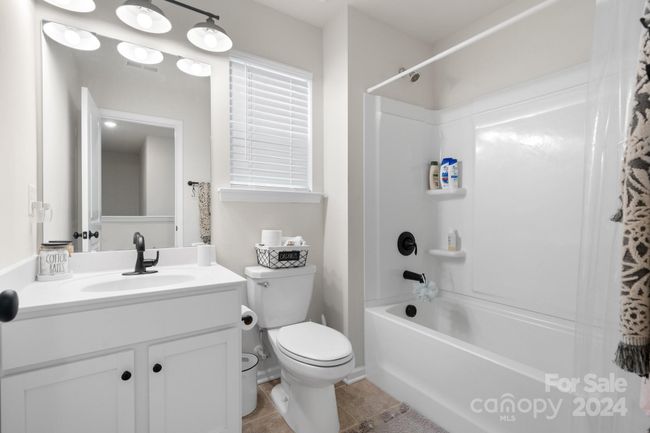 Upper level has 3 full baths! This one features tub/shower combination. | Image 21