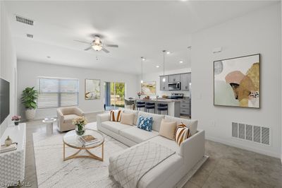 Living room featuring sink, ceiling fan, and light tile floors | Image 2