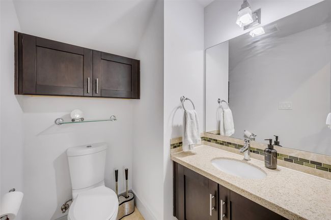 Bathroom featuring toilet and vanity | Image 14