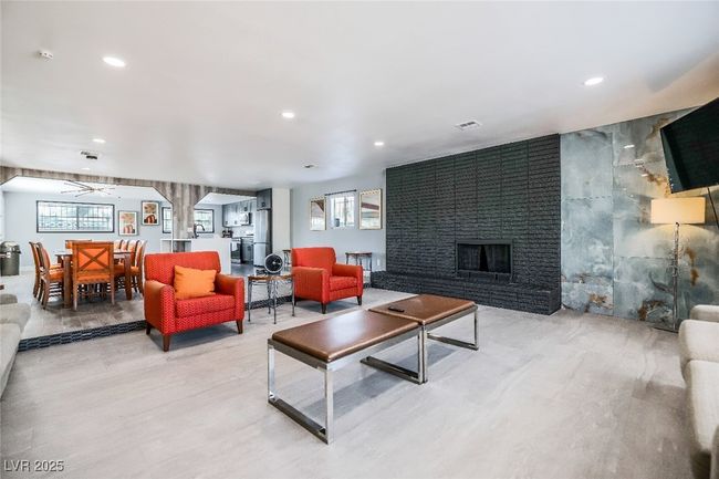 Living room featuring recessed lighting and a brick fireplace | Image 7