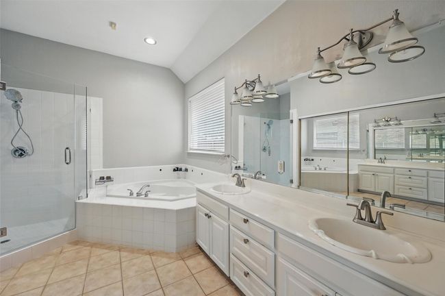 Primary Bathroom, Dual Vanity, Jacuzzi, and Seamless Shower | Image 17