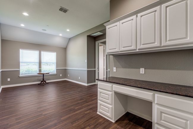 Generation suite common area with living area and built in desk, baseboards, recessed lighting, and lofted ceiling | Image 21