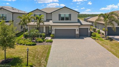 View of front of house featuring a garage and a front yard | Image 3