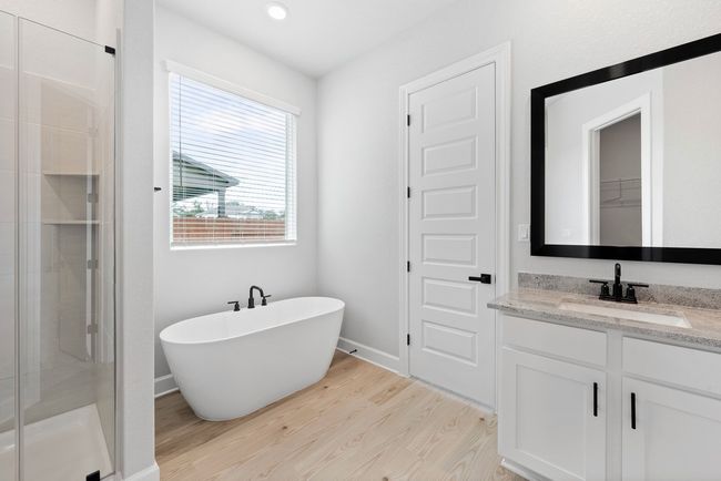 Relax in the large soaking tub or enjoy the spacious, standing shower. | Image 4