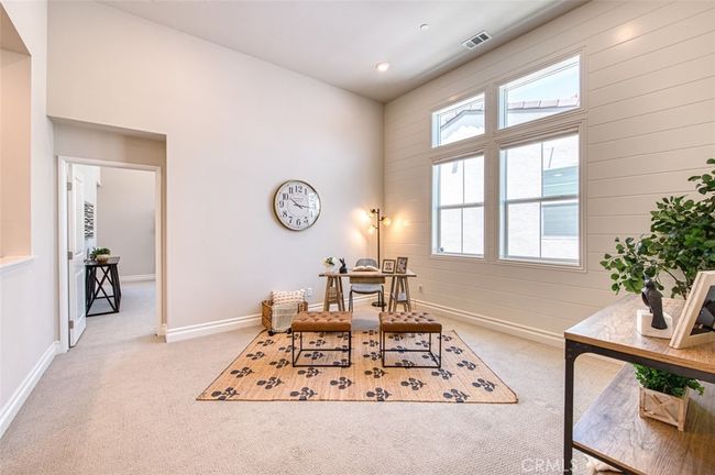 Bright and versatile 2nd floor loft with shiplap accents and high ceilings. | Image 12