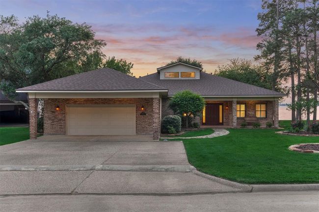 Welcome to 12022 Sagittarius Court, ideally situated on one of the most sought after streets in the gated community of Point Aquarius. This beautifully renovated home offers exceptional curb appeal and thoughtfully designed features throughout, ensuring both comfort and style for everyday living. | Image 6