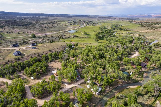 Aerial view of property and surrounding area featuring a large body of water | Image 65