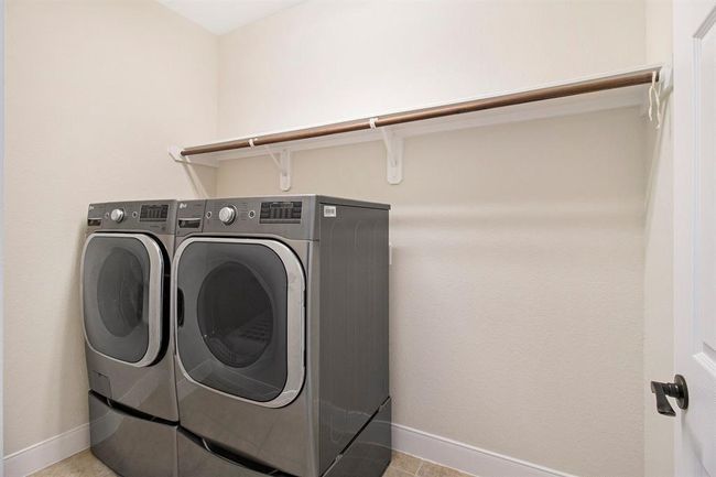 Utility Room is in-house and comes complete with high-end LG Washer & Dryer set on pedestals to make laundry easier. | Image 21
