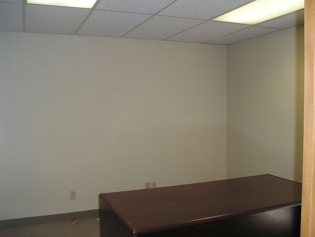 Office space with a drop ceiling | Image 13