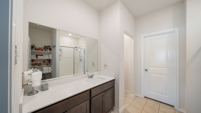 Full bath with a shower stall, tile patterned flooring, and vanity | Image 16