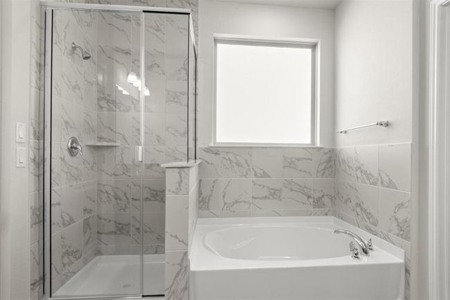 Full bath featuring a garden tub and a stall shower | Image 22