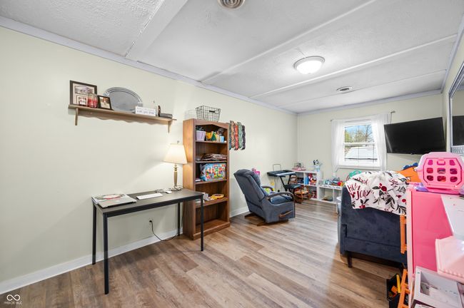 interior space with baseboards, wood finished floors, and a textured ceiling | Image 21