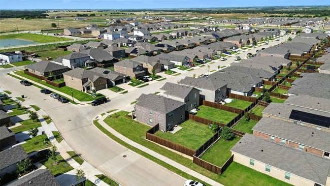 Aerial view of residential area with a large body of water | Image 4