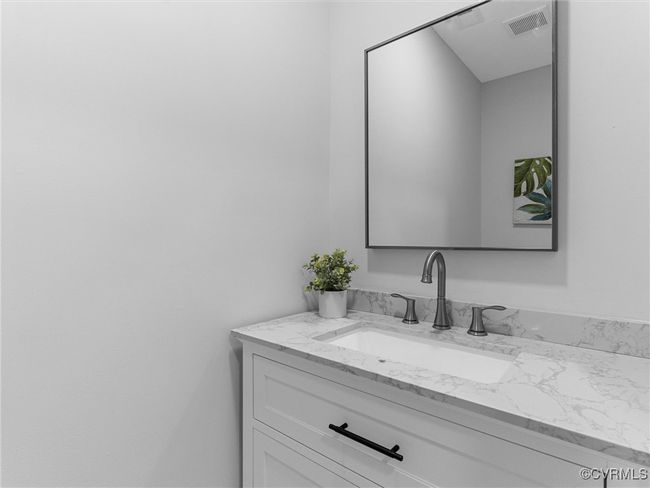 Bathroom with vanity and visible vents | Image 23