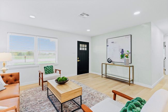 Living area with recessed lighting and light wood-style flooring | Image 8
