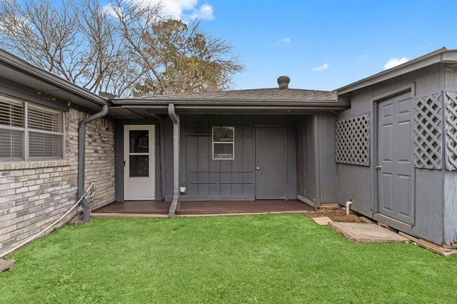 Cozy backyard area with a small patio area. | Image 33