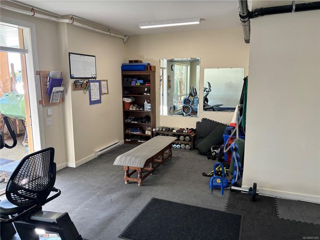 Exercise room featuring baseboard heating | Image 45