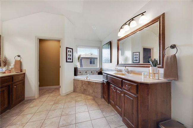 Primary bathroom with double vanitys and a separate water room. | Image 31