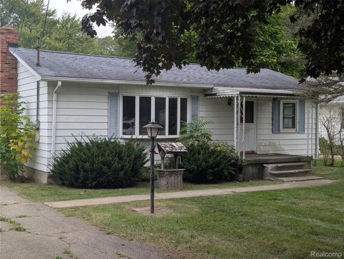 1056 Adams Rd, Burton, MI, 48509-2323 | Card Image