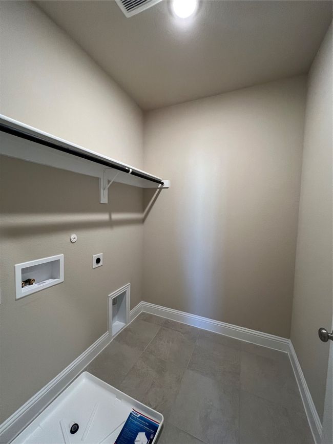 Laundry room with laundry area, baseboards, hookup for a gas dryer, hookup for a washing machine, and electric dryer hookup | Image 13