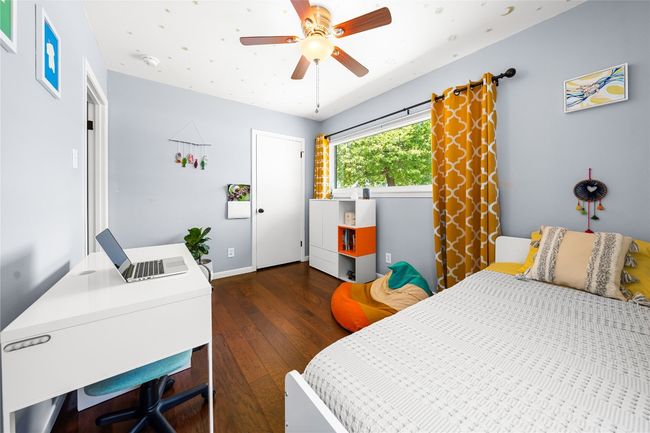 Guest bedroom at the front of the home with closet and large window to front yard! | Image 15