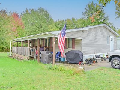 View of property exterior featuring a lawn | Image 2