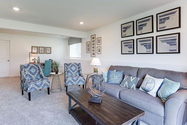 A second view of the lower level family room. Imagine the possibilities!! Photo is of model home. Colors and options may vary. Ask Sales Agent for details. | Image 32