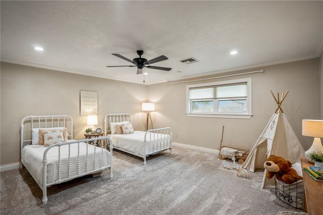 Carpeted bedroom featuring recessed lighting, visible vents, crown molding, and baseboards | Image 28