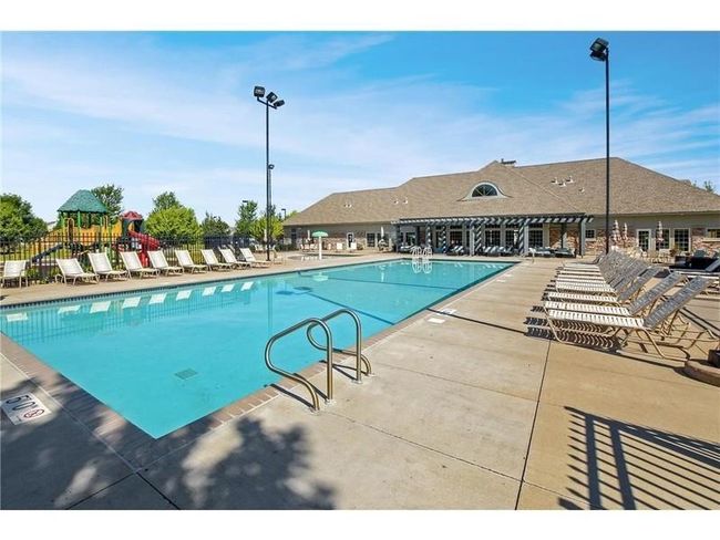 Your assoc fees include full access to the walkable and beautiful Waters Edge Community Center! pool, gym, and party room with kitchen! | Image 28