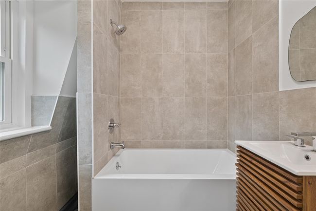 Full bathroom featuring vanity and tile walls | Image 19