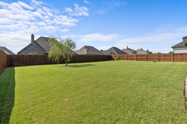 View of fenced backyard | Image 29