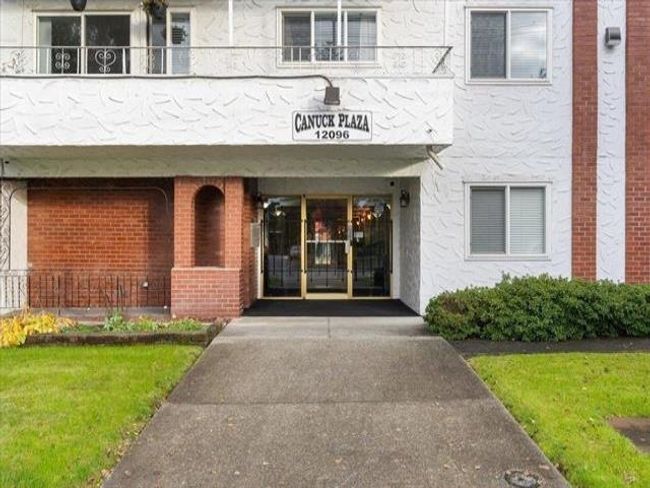 View of exterior entry with a balcony and stucco siding | Image 25