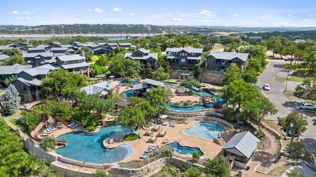 THESE CLIFFSIDE CONDOS SURROUND THE AMAZING POOL | Image 30