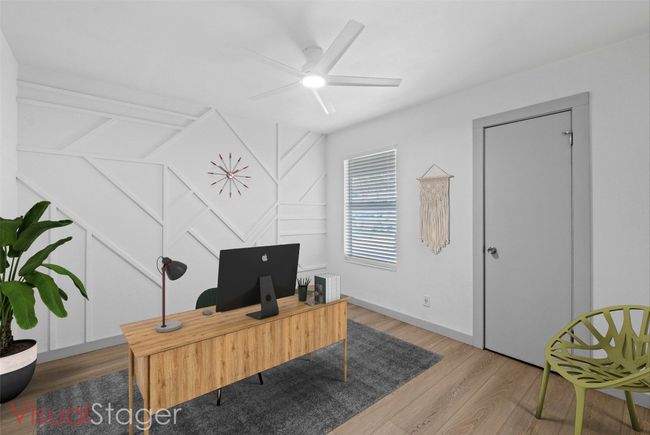 Third bedroom featuring custom wood accent wall & walk-in closet. (Virtually Staged) | Image 15