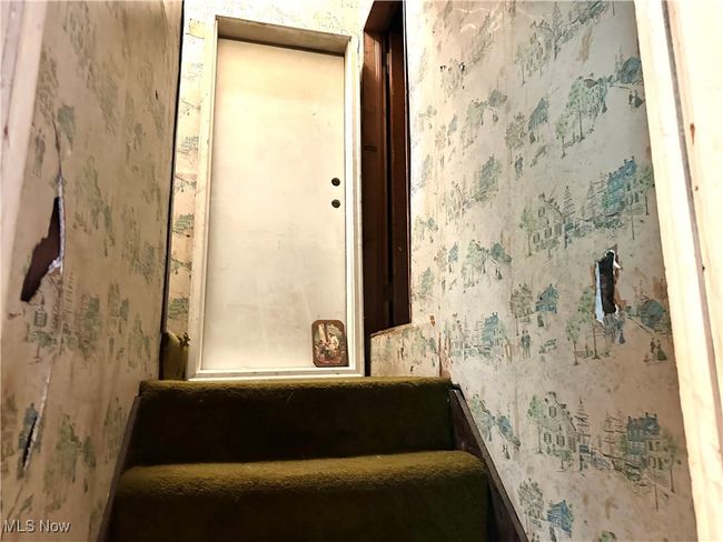 Stairs with wallpapered walls to 2nd level dormer bedroom and attic area . | Image 18