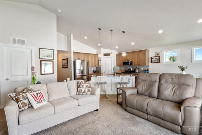 Living area featuring lofted ceiling and recessed lighting | Image 13
