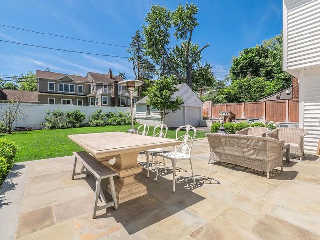 View of patio with outdoor dining space, an outdoor structure, outdoor lounge area, and grilling area | Image 24