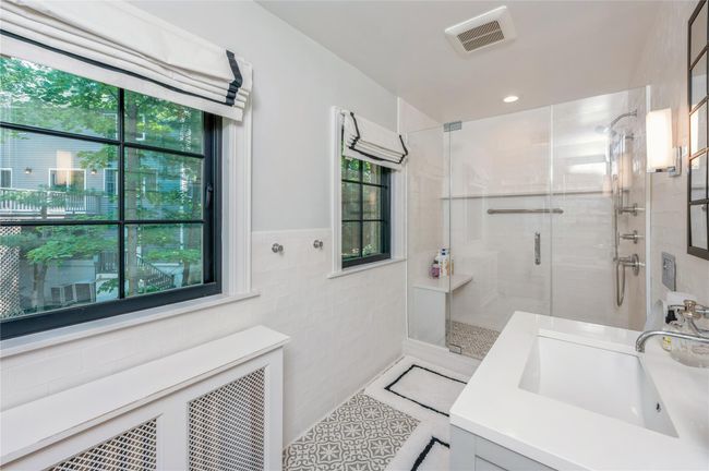 Renovated bathroom with radiant heated floor in north wing. | Image 18