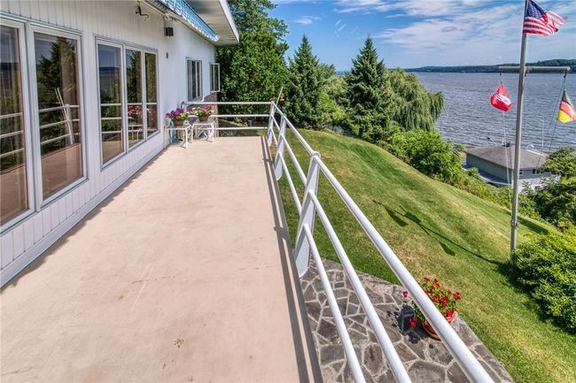 Balcony featuring a water view | Image 7